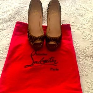 Worn Louboutin high heels. Tips on heels need to be replaced.